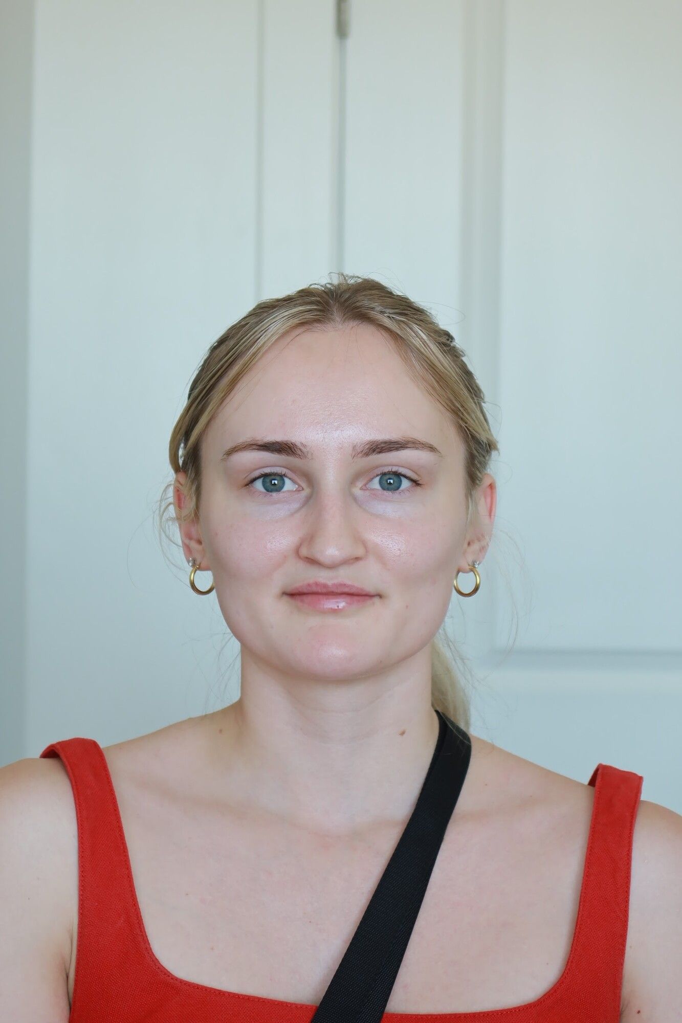 Before: a blonde woman in a red top with bare skin