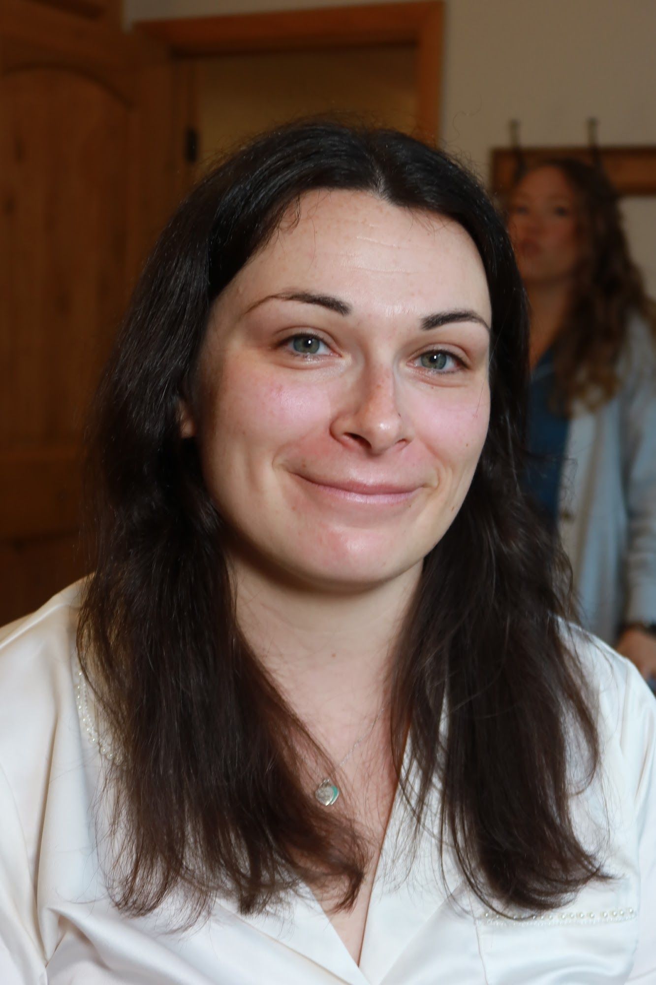 Before: a woman in a white robe with bare skin and dark hair down
